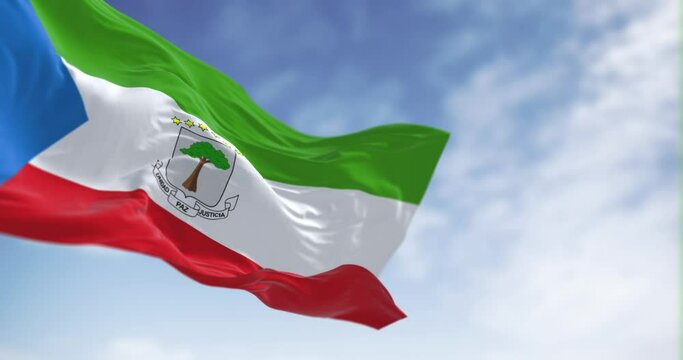 National flag of Equatorial Guinea waving in the wind on a clear day