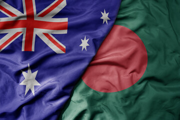 big waving realistic national colorful flag of australia and national flag of bangladesh . © luzitanija