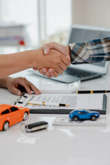 Car dealership, holding car keys to customer, new owner after signing lease contract, purchase contract in document, car sale contract.