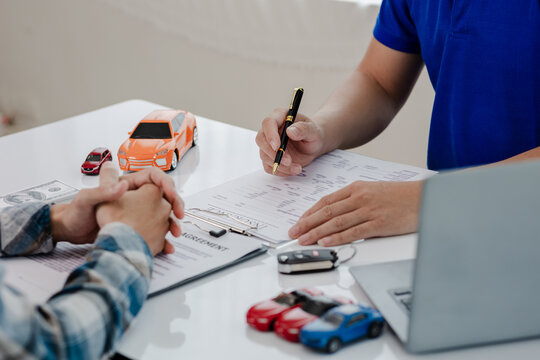 Up close shows the calculator for the cost of the car and the rental interest that must be paid. The car dealer or sales manager offers to sell the car and explains the terms of the car contract and i