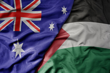 big waving realistic national colorful flag of australia and national flag of palestine .