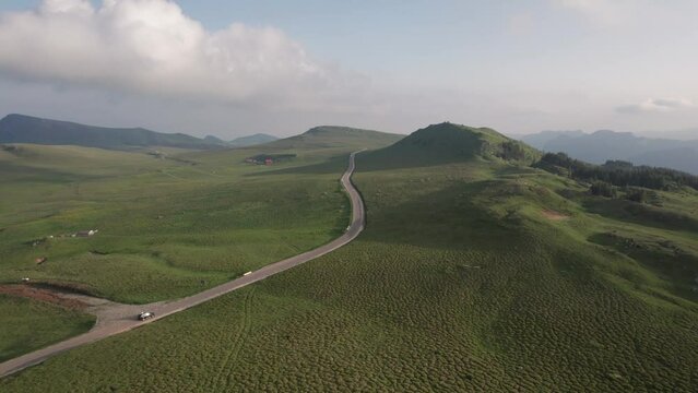 Aerial top view above Transbucegi winding road, in Transylvania	
