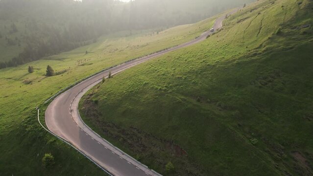 Aerial top view above Transbucegi winding road, in Transylvania	
