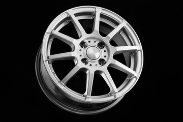 Obraz premium Sports silver cast disc on a black background. wheels and auto parts