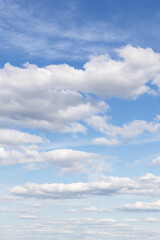 Beautiful epic soft gentle blue sky with white fluffy cloud in sunlight background texture