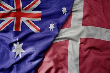 big waving realistic national colorful flag of australia and national flag of denmark . © luzitanija