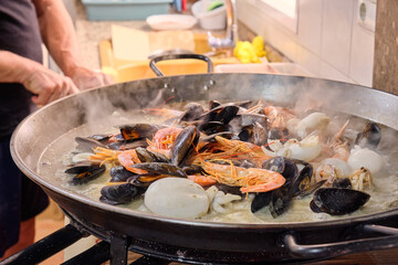 assorted seafood in a frying pan