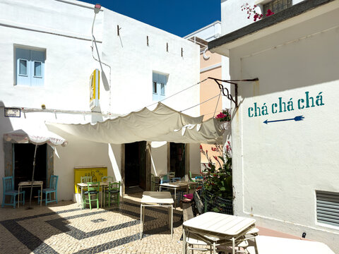 The colourful chairs and tables of the popular Cha Cha Cha restaurant serving meals made from ingredients from the local market