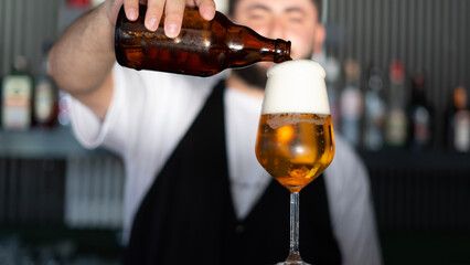barmen pouring beer to a glass