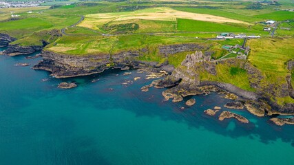 Aerial view of the historic Dunluce Castle located in the Antrim region of Northern Ireland