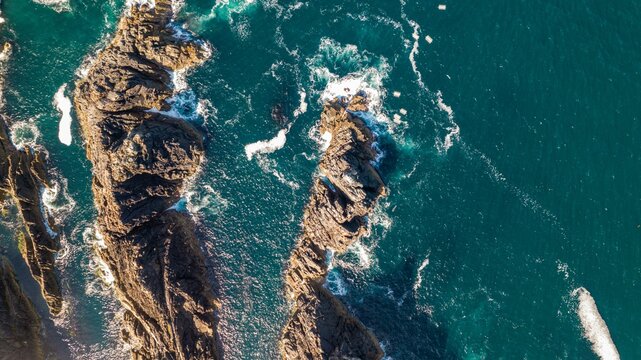 Aerial view of ocean seen from above at Malin Head. Ulster, Irel