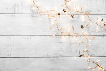 christmas garland lights on wooden background