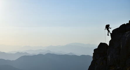 High Altitude Rock Climbing Man Silhouette