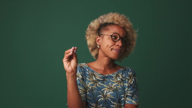 Young woman tired of talking gesturing bla bla bla , isolated on blue background