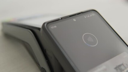 The video presents advantages of NFC technology for contactless payment via smartphone on POS-terminals. Electronic purchases become reality thanks to fast and secure transactions through terminals