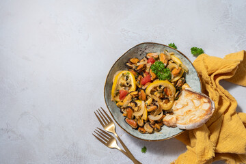 cooked mussels with parsley and lemon in white bowl, top view
