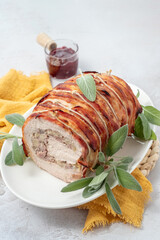 Pork Loin Roll Stuffed with sausage, Apples, Walnuts and Herbs
