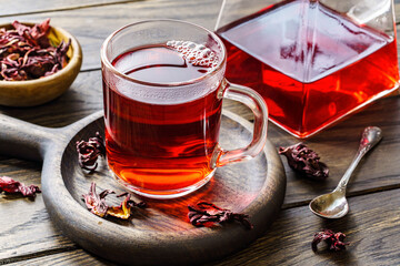 Cup of hot hibiscus tea on table