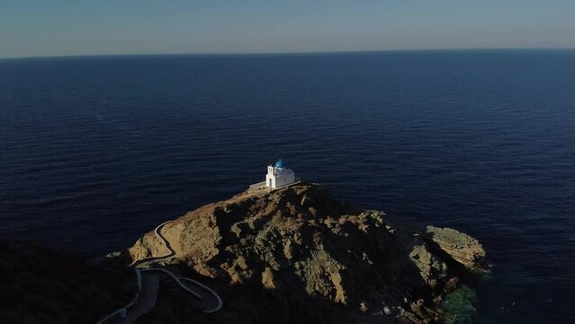 Drone footage of the Greek Orthodox Church of the Seven Martyrs by the sea in Sifnos, Greece
