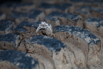 Wedding ring in Jeep tire with sand.