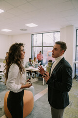 Two business colleagues talking