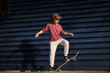 Fotobehang Skateboard Boy doing stunt on skateboard on street  © ADDICTIVE STOCK CORE