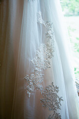 Detail of lace on wedding dress.
