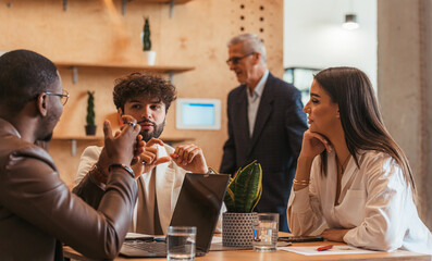 Three work friends talking
