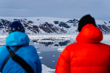 People watching the arctic landscape from a boat