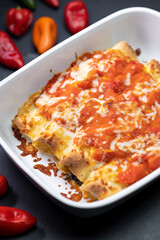 burritos baked with tomato sauce and cheddar cheese