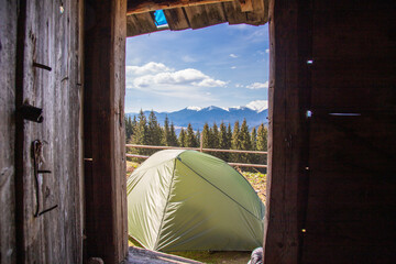 A tent against the background of the Carpathian Mountains.