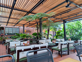 Cozy and warm outdoor dining area with a little touch of greens 