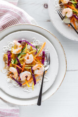 Plates of deconstructed Vietnamese spring rolls ready for eating.