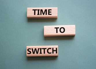 Time to Switch symbol. Concept word Time to Switch on wooden blocks. Beautiful grey green background. Business and Time to Switch concept. Copy space
