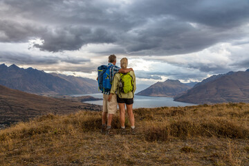 Fototapeta na wymiar Active seniors hiking travel remote New Zealand landscape