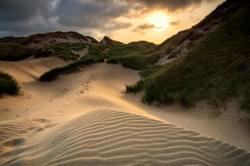 sunset over sand dunes