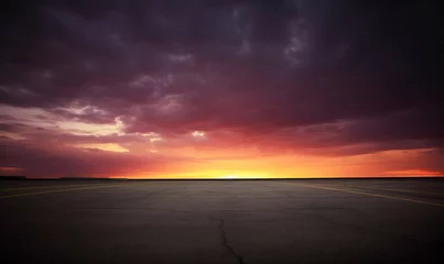 Zelfklevend Fotobehang Dark floor background with sunset clouds and the night sky in the distance large asphalt road. High quality photo © oksa_studio
