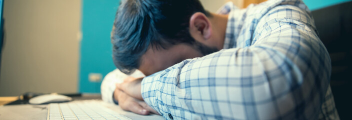 sad man in office desk