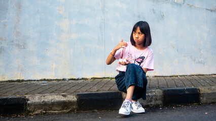 Smiling Girl Standing on Urban Street