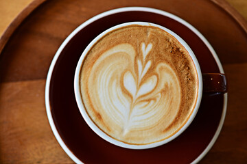 high angle view of coffee cup on wood grain table Drinking Concept: Hot Coffee, Latte, Espresso, Cappuccino