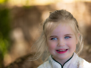 Head shot of smiling little girl.