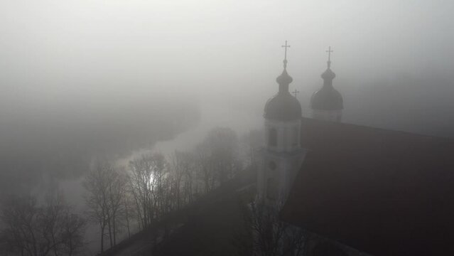 Drone view of the Church of the Discovery of the Holy Cross in Vilnius, Lithuania with misty sky