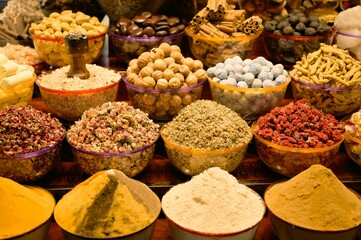 Closeup of an assortment of dried fruits and vegetables and spices for sale