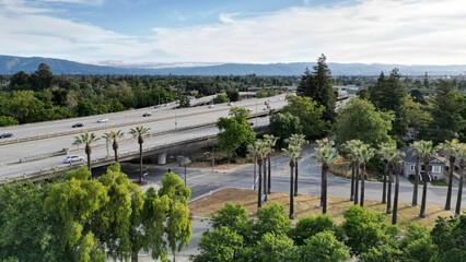 Aerial view of a highway with cars driving along the road