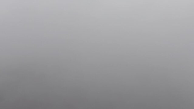 Landscape view of stormy cloudscape with gray sky and vague horizon for wallpaper