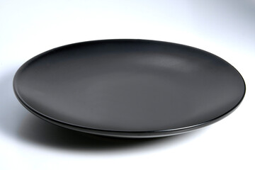 Empty flat Black plate with rounded edges