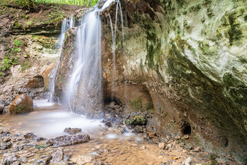 Obraz premium Dauda waterfall in the forest from a 2 metre cliff