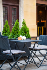 Chairs and table on empty terrace at cafe .