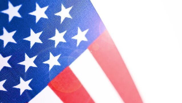USA flag background, design template, 4k stock video. American flag texture with glare and lens flare effect.
