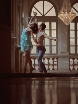 Graceful couple dancing in classic building